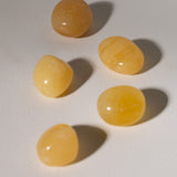 Orangen Calcit Trommelstein